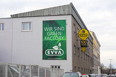 Photo of poster on EVVA frontage "We are Green Factory"